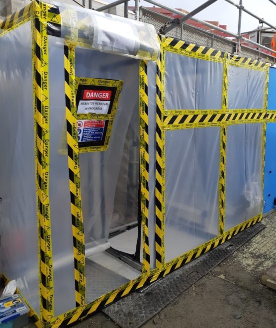 Enclosure set up for asbestos insulation board removal
