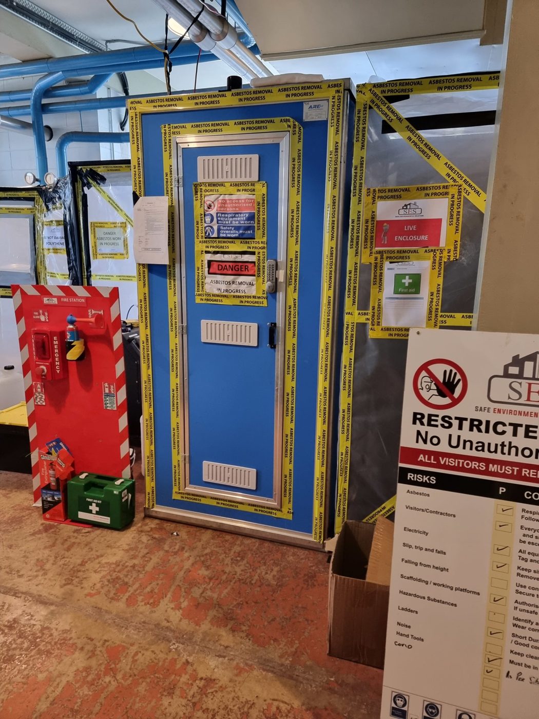 Sealed enclosure for internal asbestos flooring removal