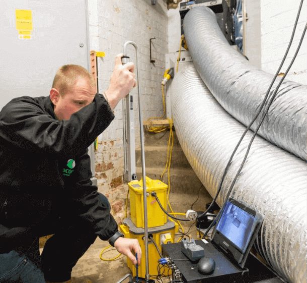 SES building maintenance technician inspecting plant room equipment