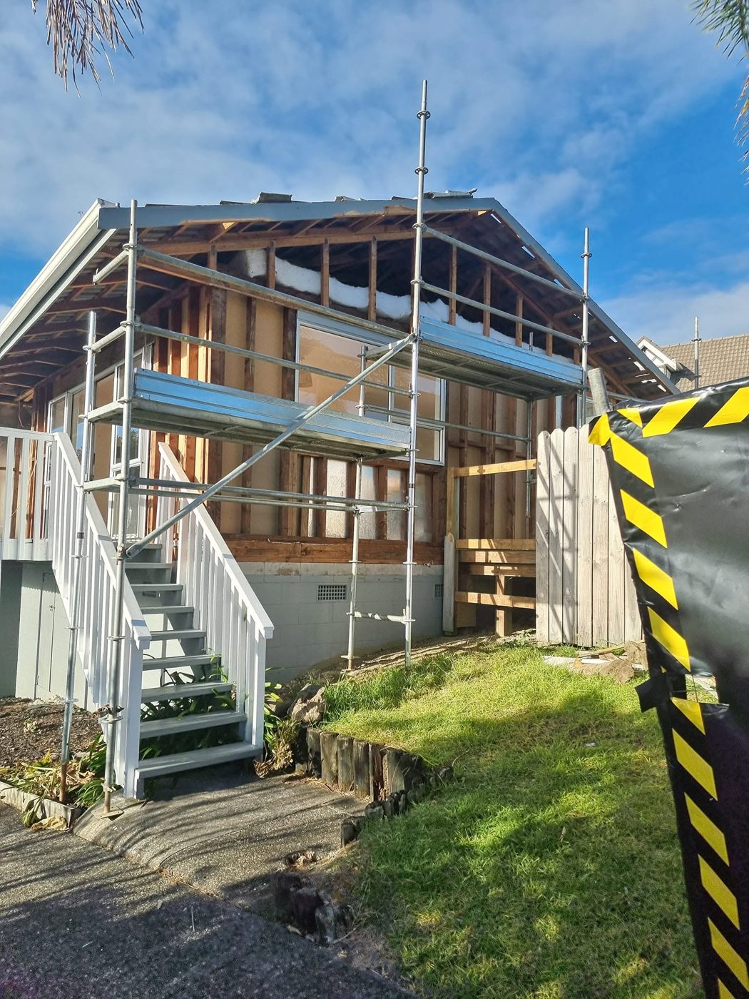 Scaffold and hazard tape during cladding removal