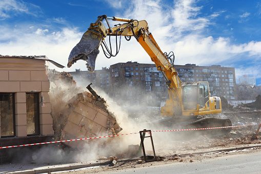 SES Demolition excavator clearing a demolition site